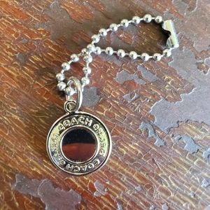 Coach round silver tag Keychain. Hang tag